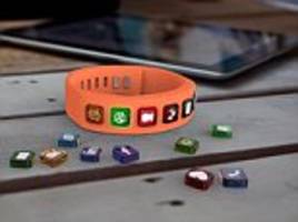 Make Facebook friends with a high-five! £50 smart wristband vibrates and flashes to keep you connected to social networks